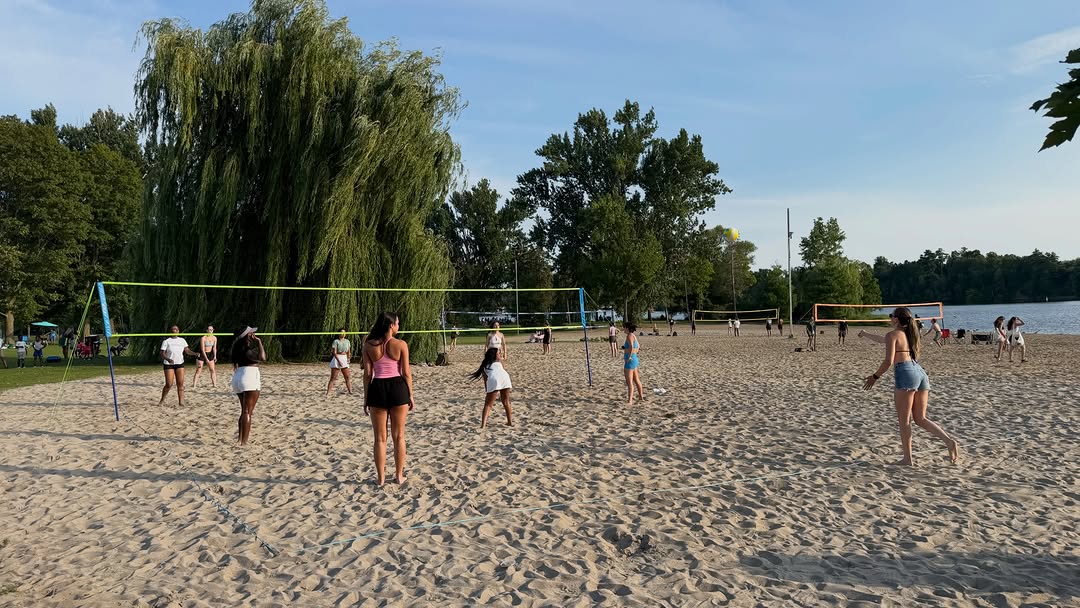 Volleyball players on the sand at Mooney's Bay
