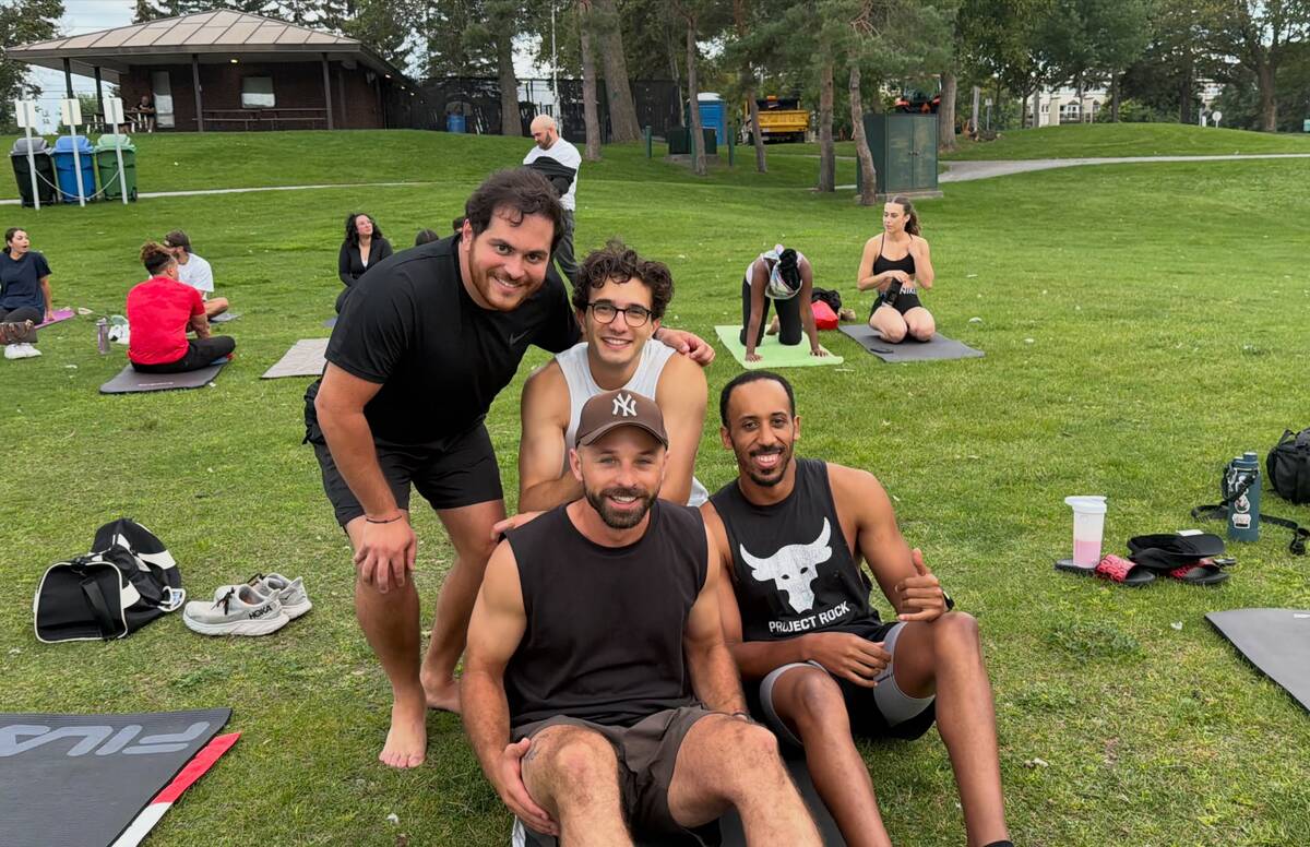Four friends smiling together after the Pilates class